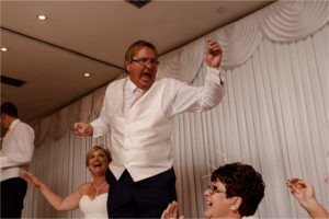 Father of the Bride dancing on a chair