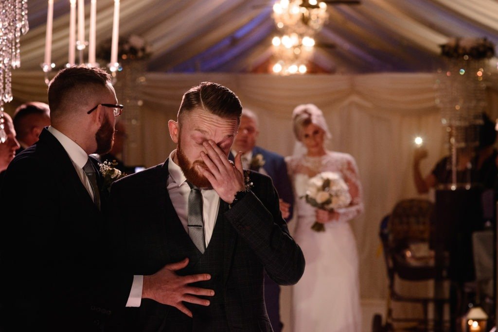 Groom becomes emotional as bride walks down the aisle for their wedding ceremony