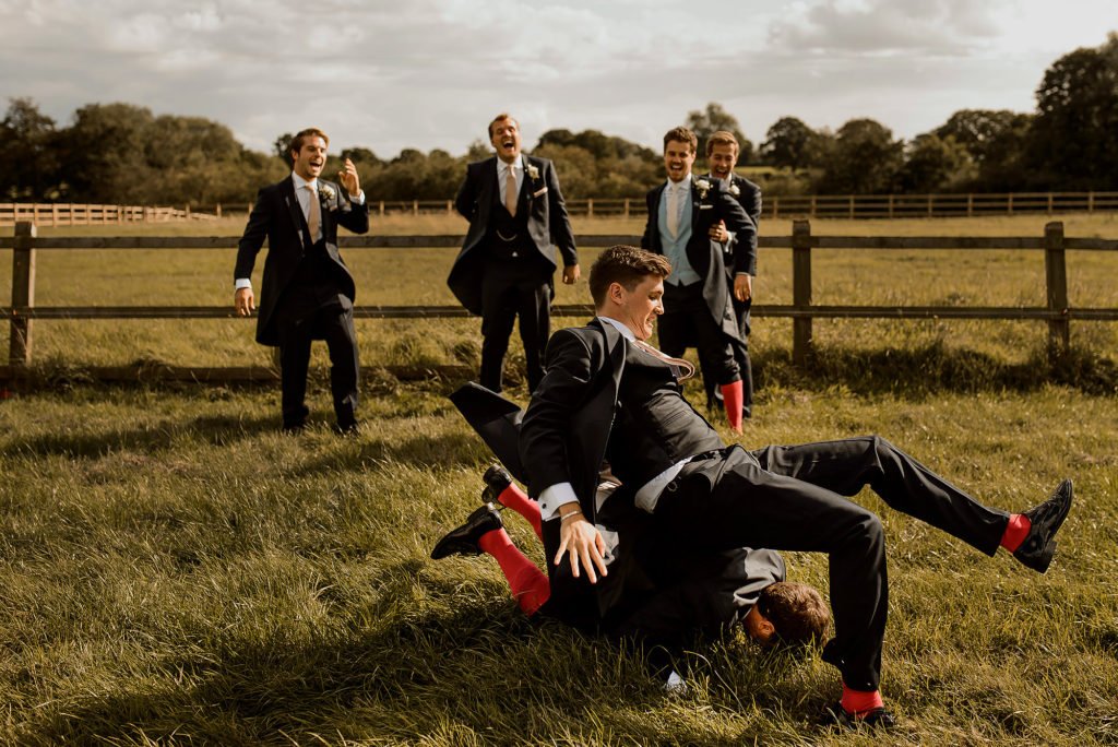 Groomsmen falling over