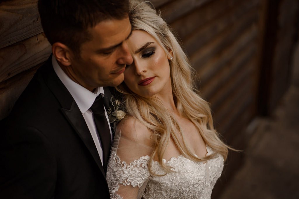 Bride resting her head on Groom's chest