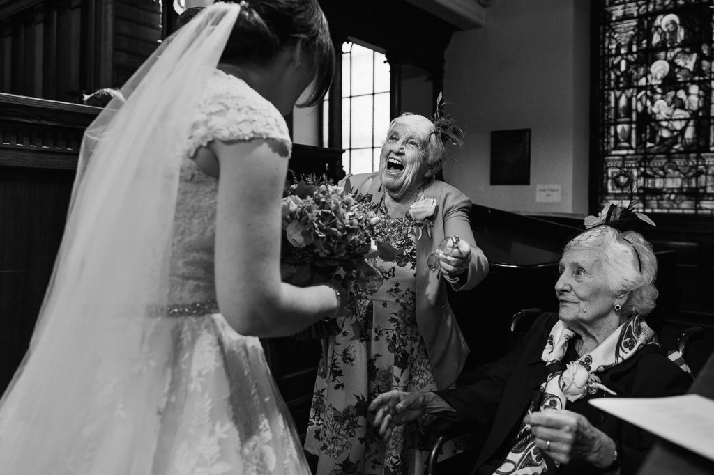 Elderly Wedding Guest goes to hug the Bride