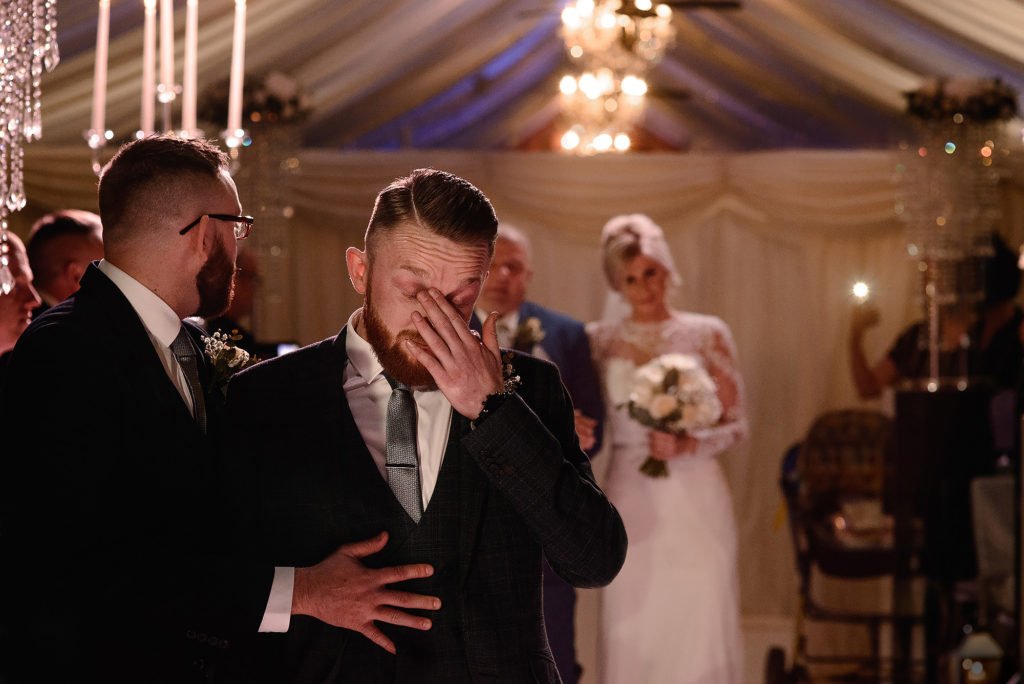 Groom becomes emotional as the Bride walks down the aisle for their wedding ceremony