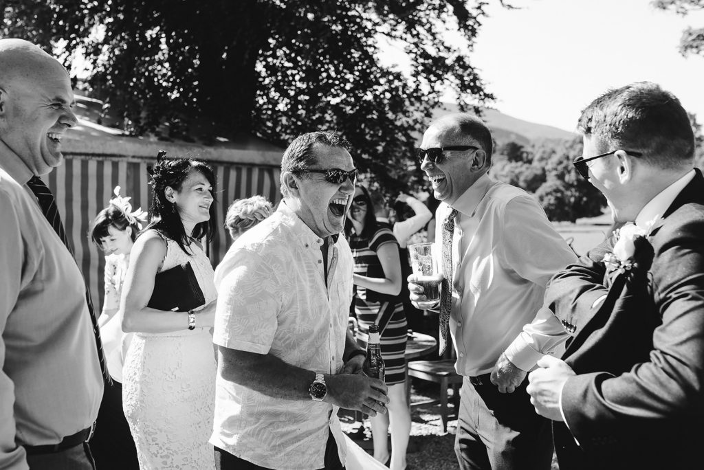 Wedding Guests laughing during the drinks reception