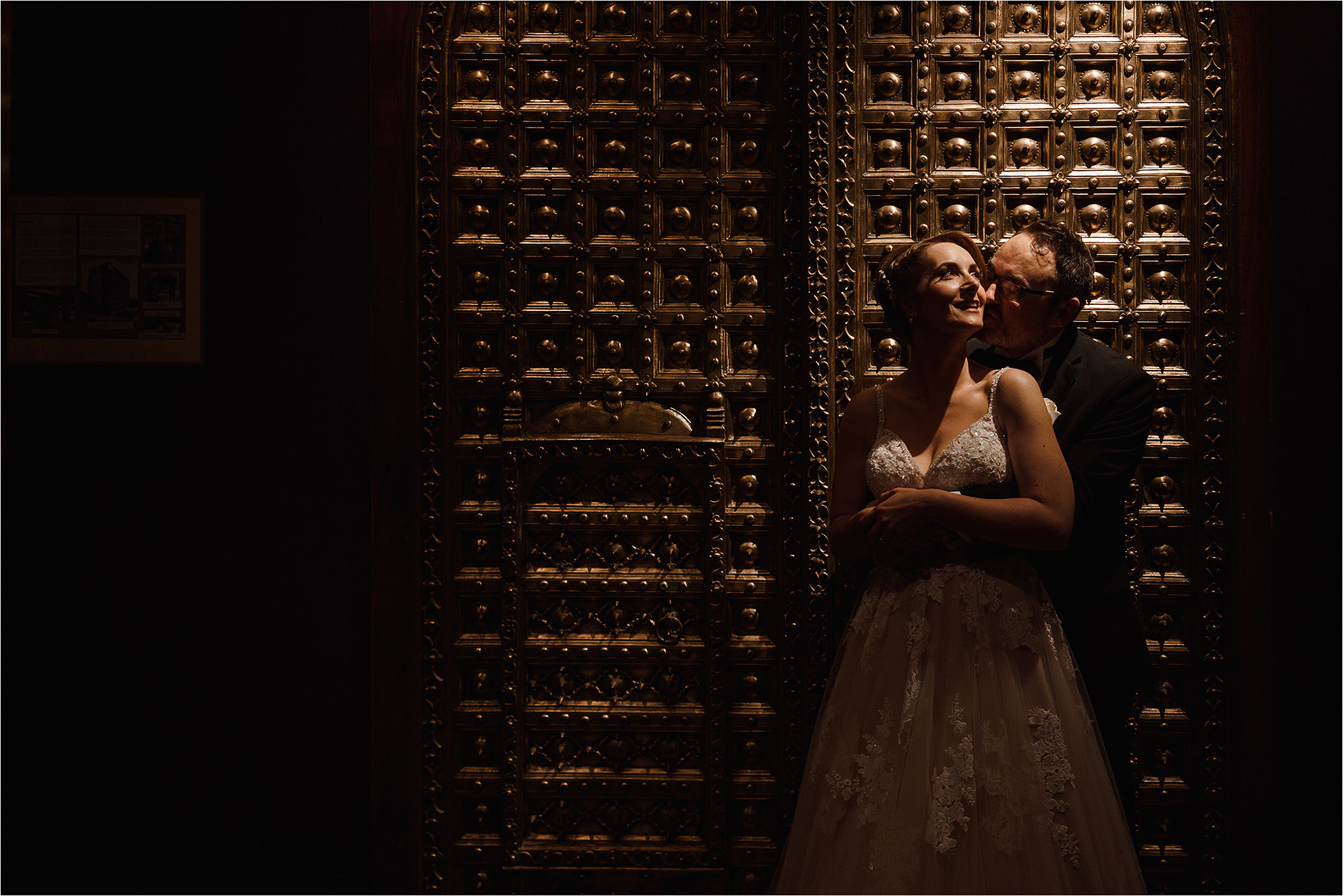 Bride and Groom in front of an ornate door
