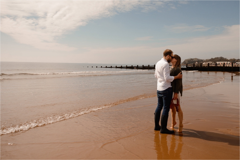 Couple kissing on the beach