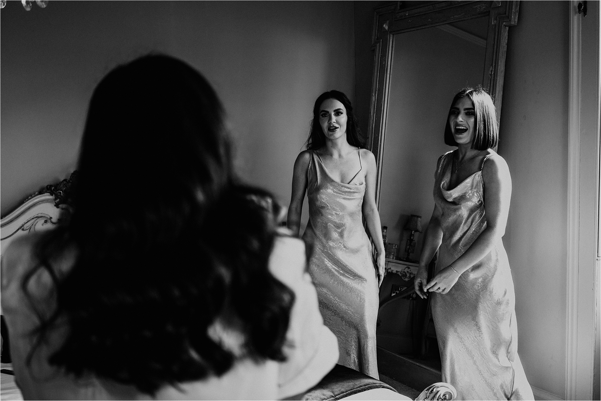 Bridesmaids laughing with the Bride