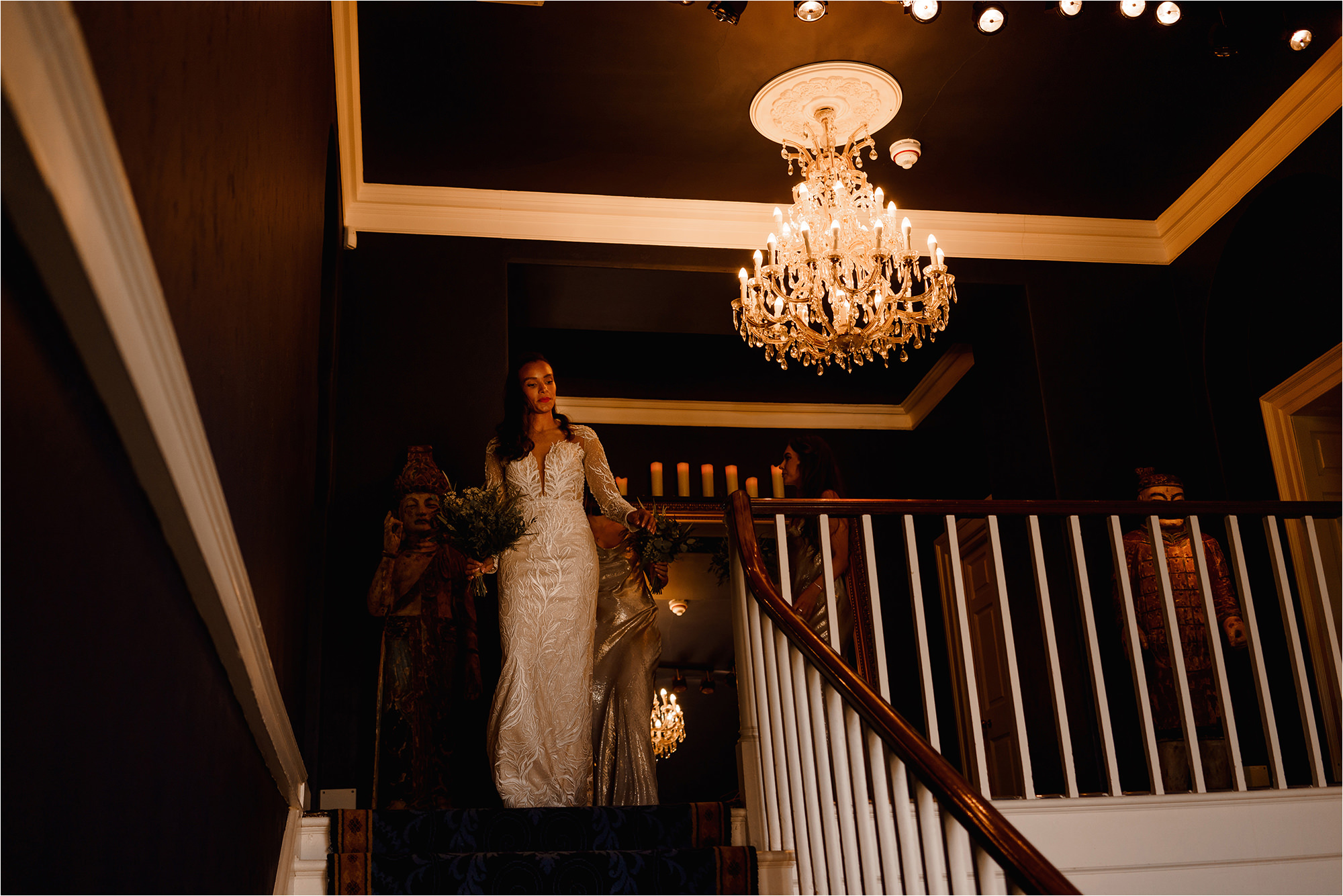 Bride walking down the stairs of Newton Hall