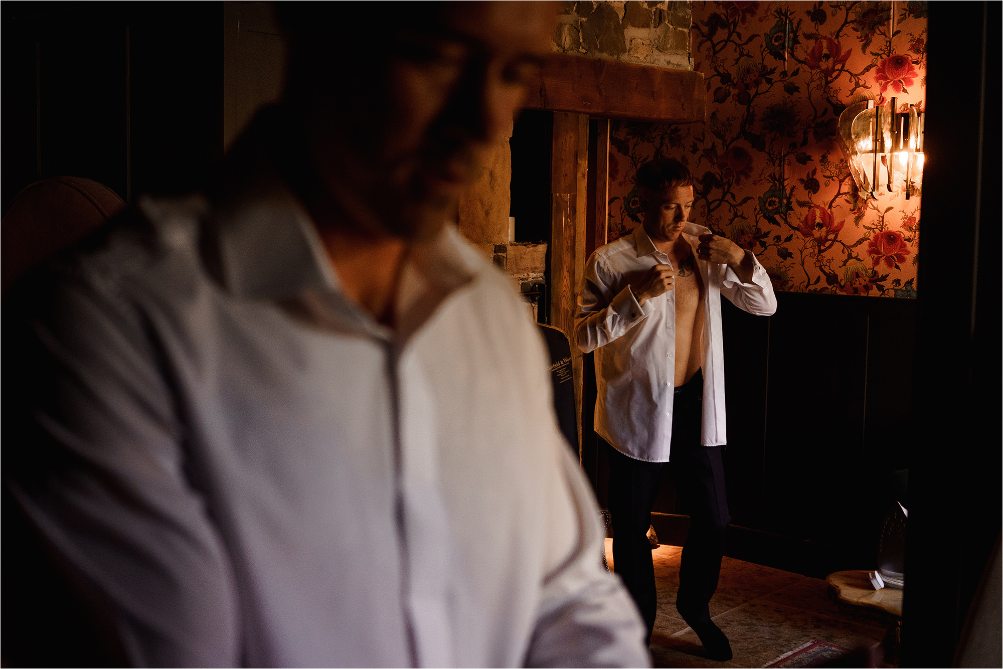 Groom and best man getting dressed