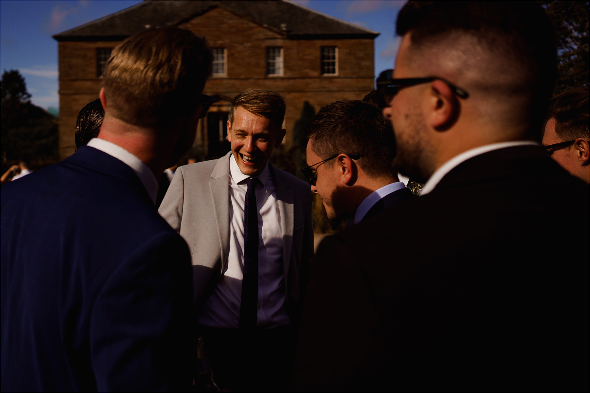 Documentary shot of Wedding Guests laughing