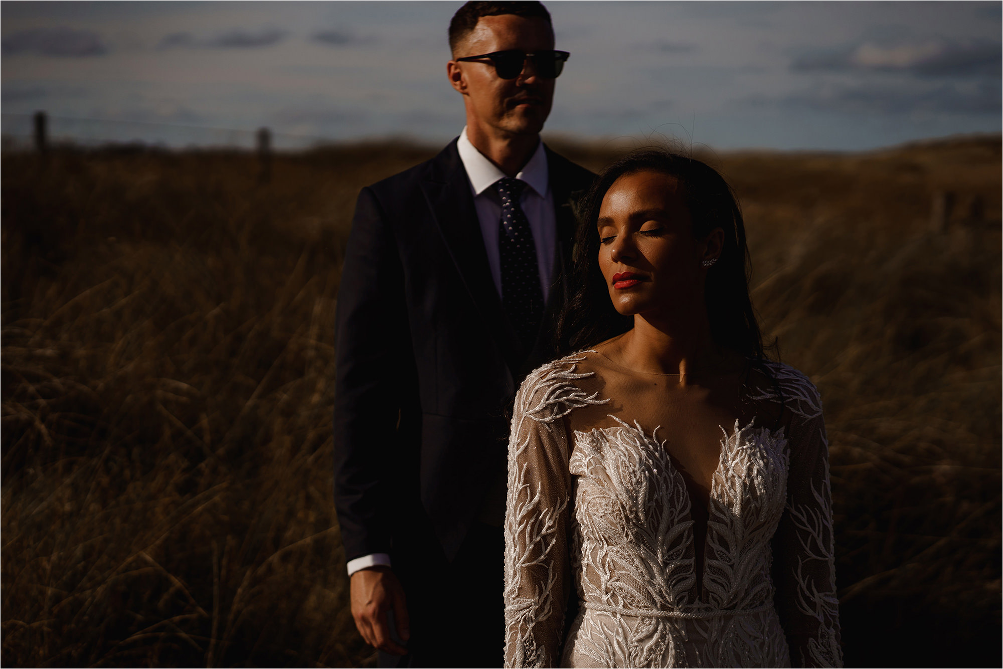 Groom stood behind the Bride
