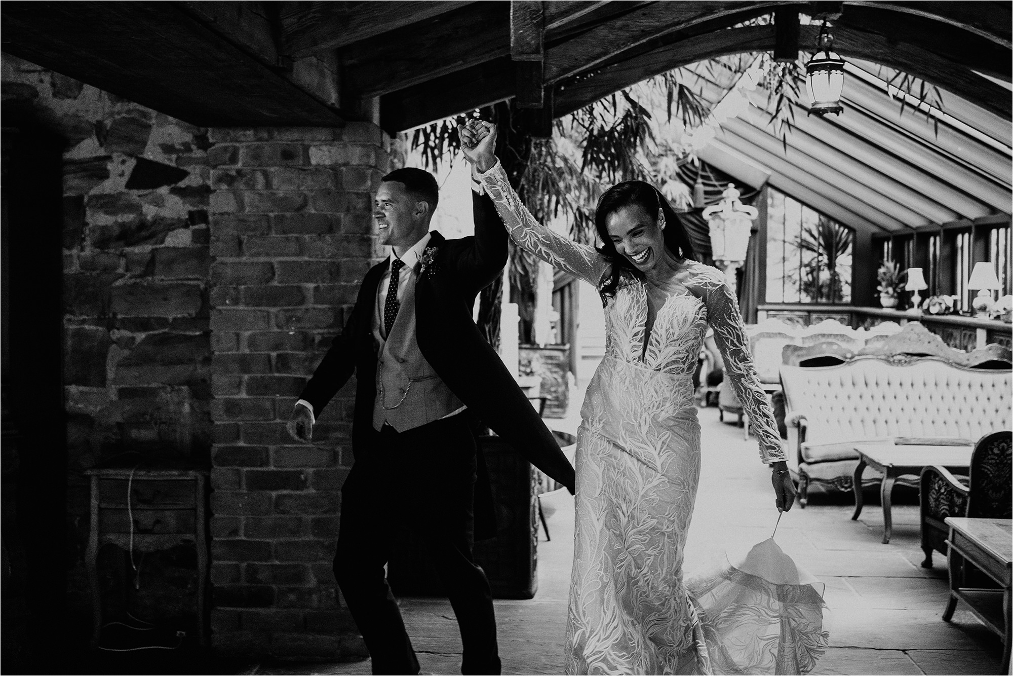 Bride and Groom with hands in the air