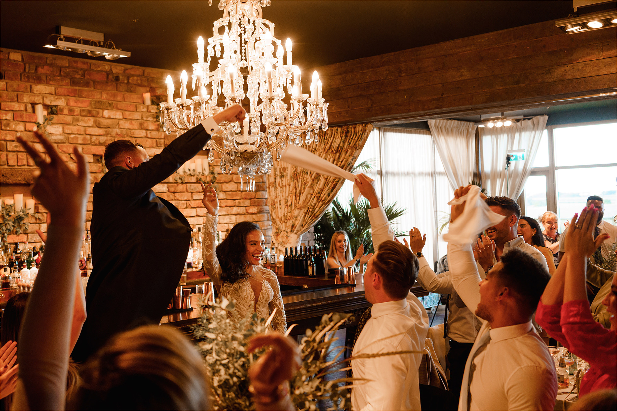 Wedding Guests swinging their napkins in the air