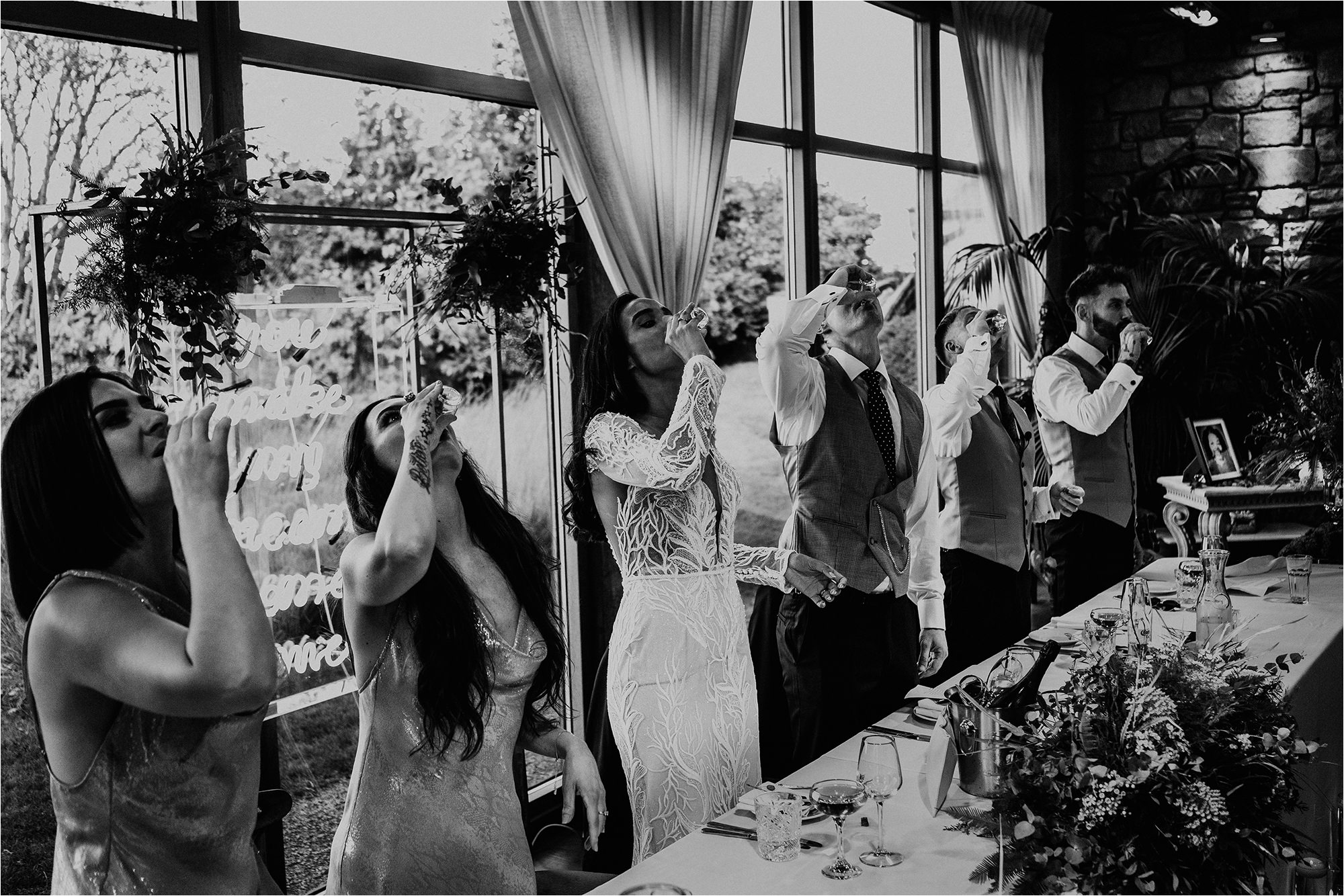 Everyone stood up having a toast drink