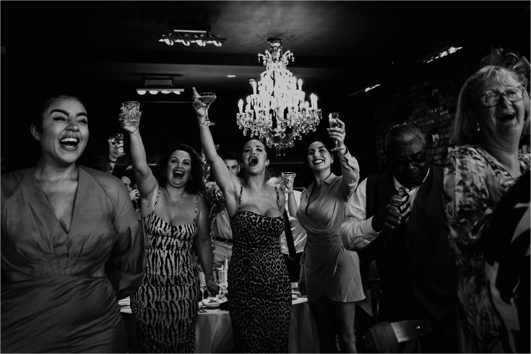 Wedding Guests toasting the Bride and Groom