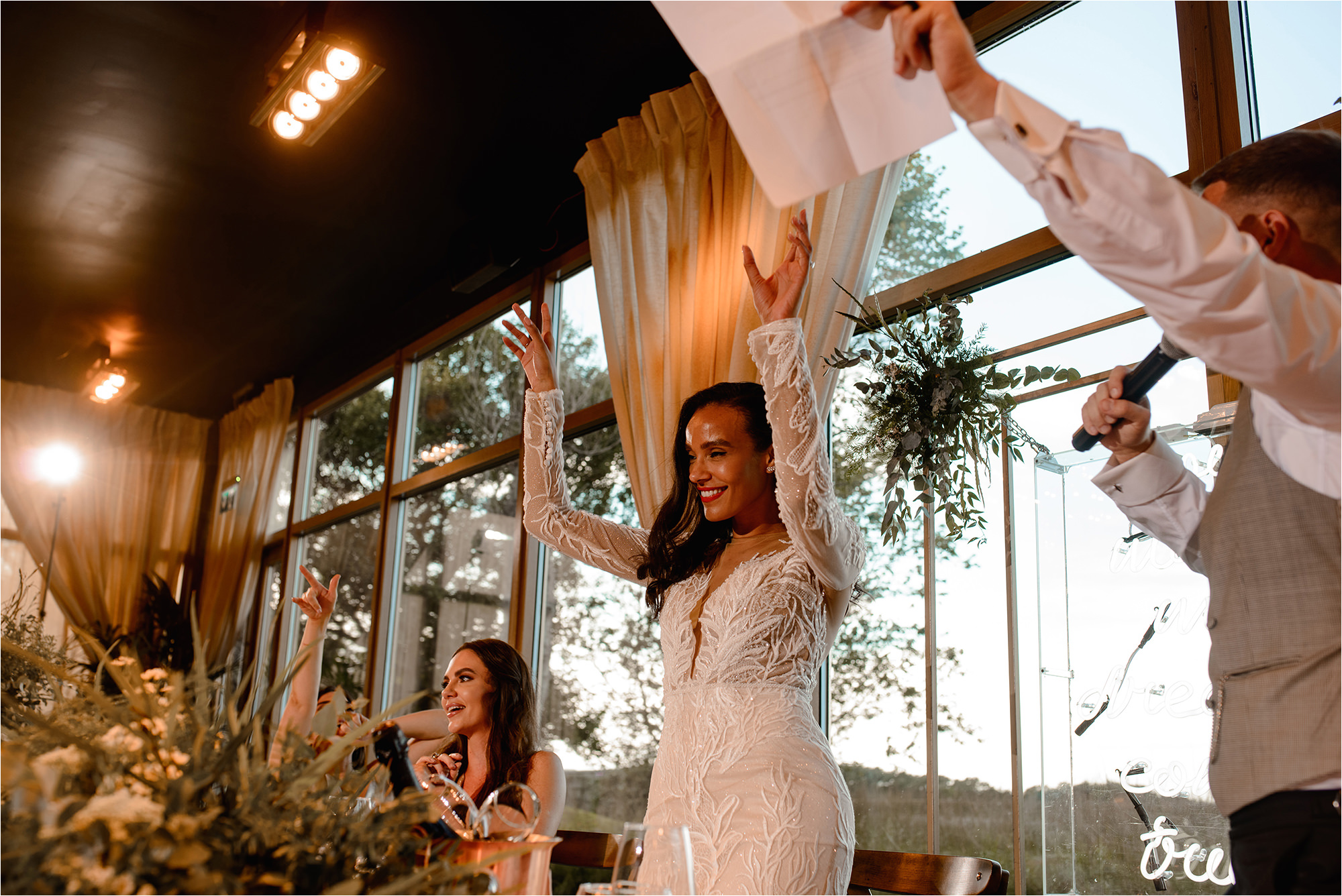 Bride with her hands in the air