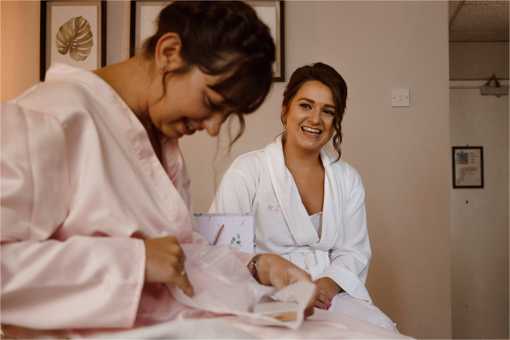 Bride laughing with her Bridesmaid