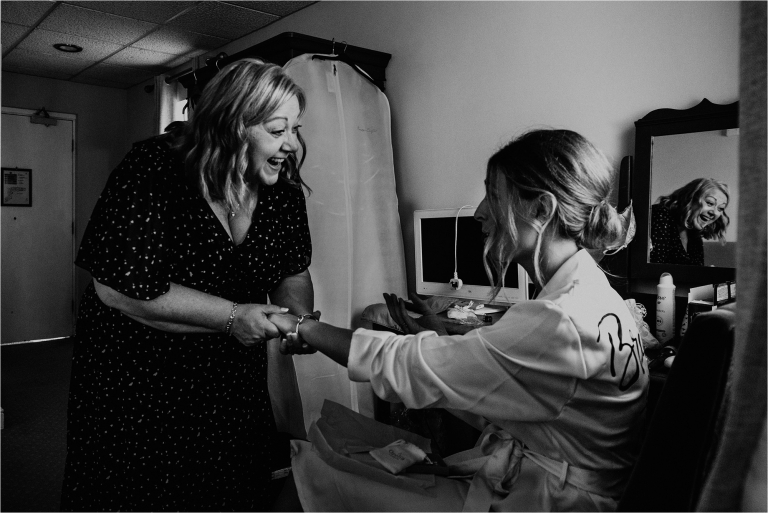 Mother of the Bride laughing with Bridesmaid
