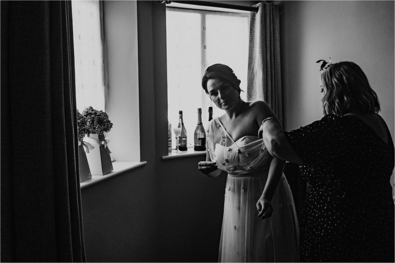 Bride getting her dress on