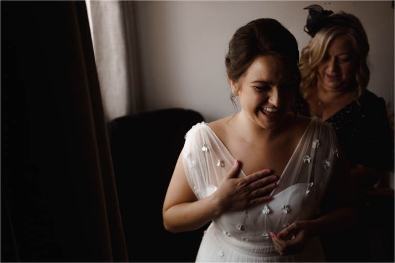 Bride laughing during wedding preparations