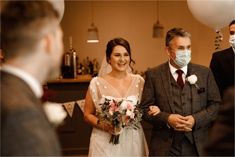 Bride walking up the aisle with the Father of the Bride