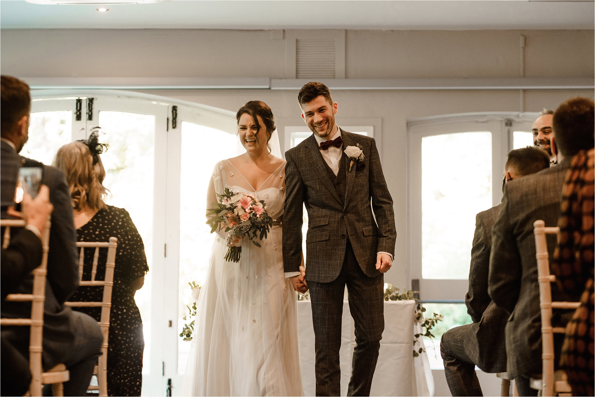 Bride and Groom walking up the aisle together