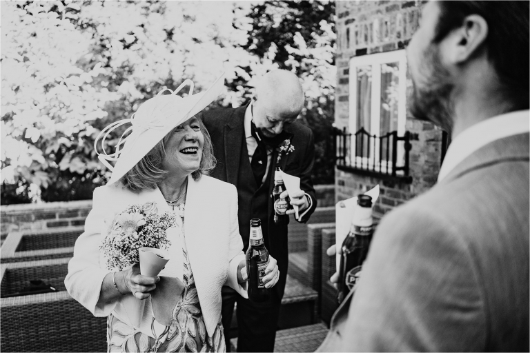 Mother of the Groom laughing during drinks reception