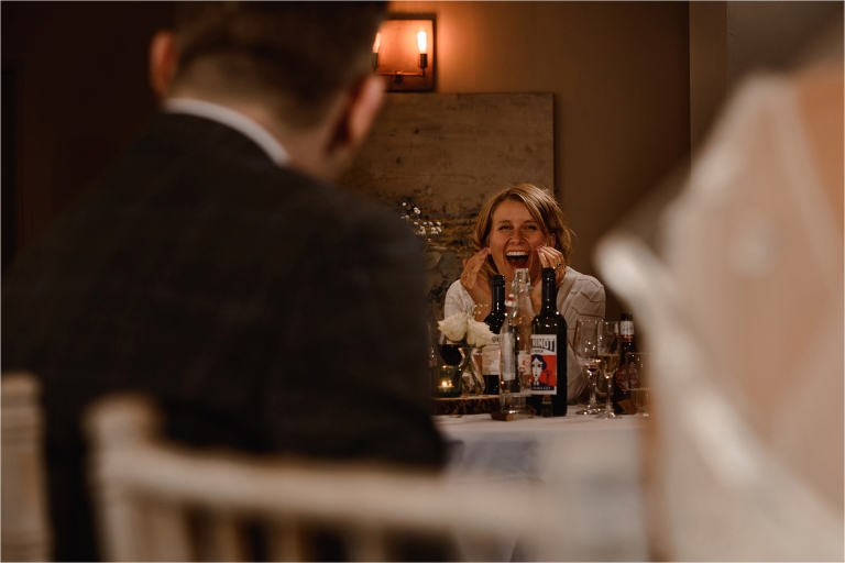 Wedding Guests laughing at the speeches