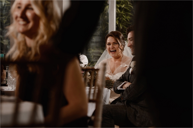 Bride laughing at the speeches