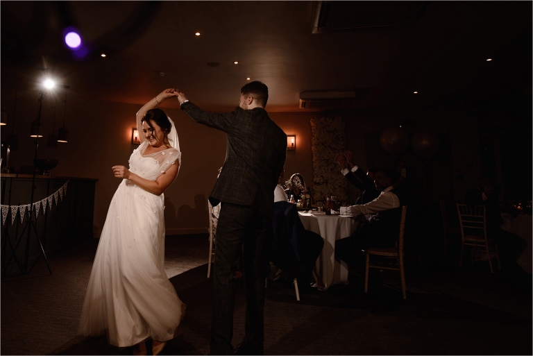 Groom twirling the Groom during their first dance