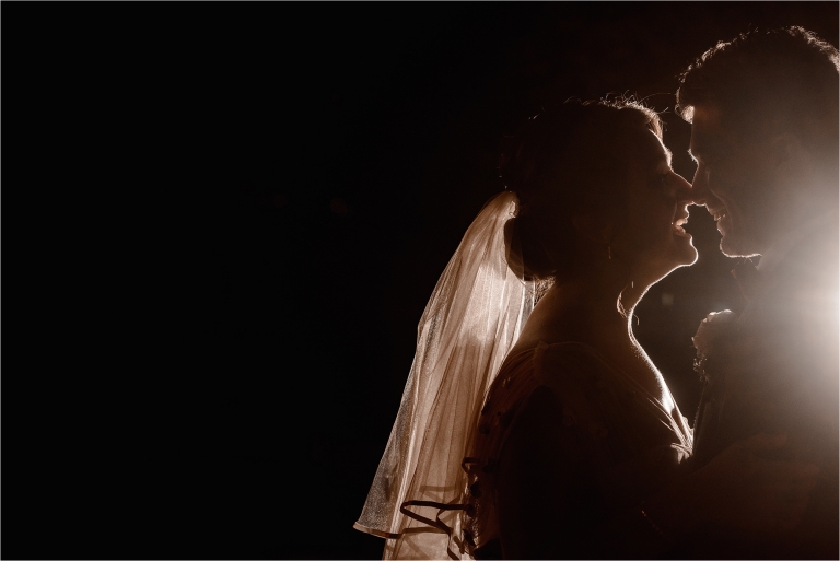 Bride and Groom backlit with off camera flash
