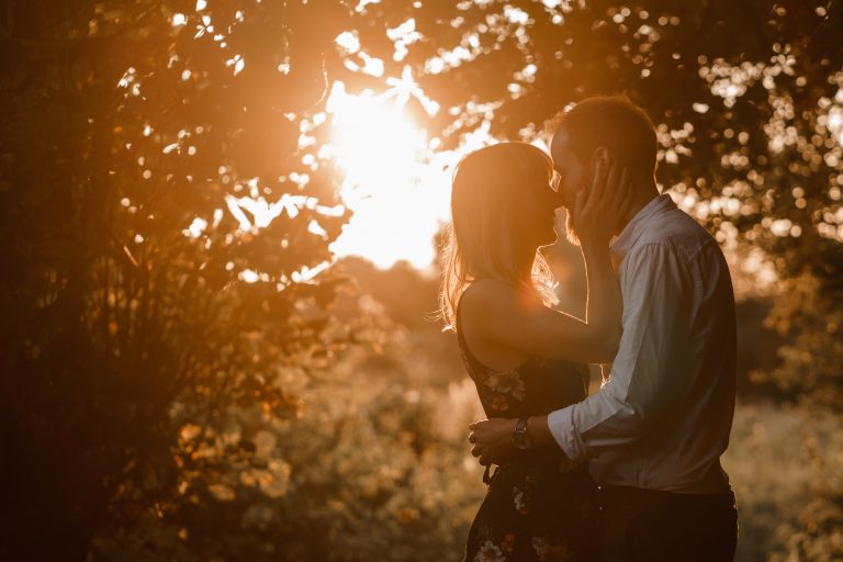 Couple kissing at golden hour