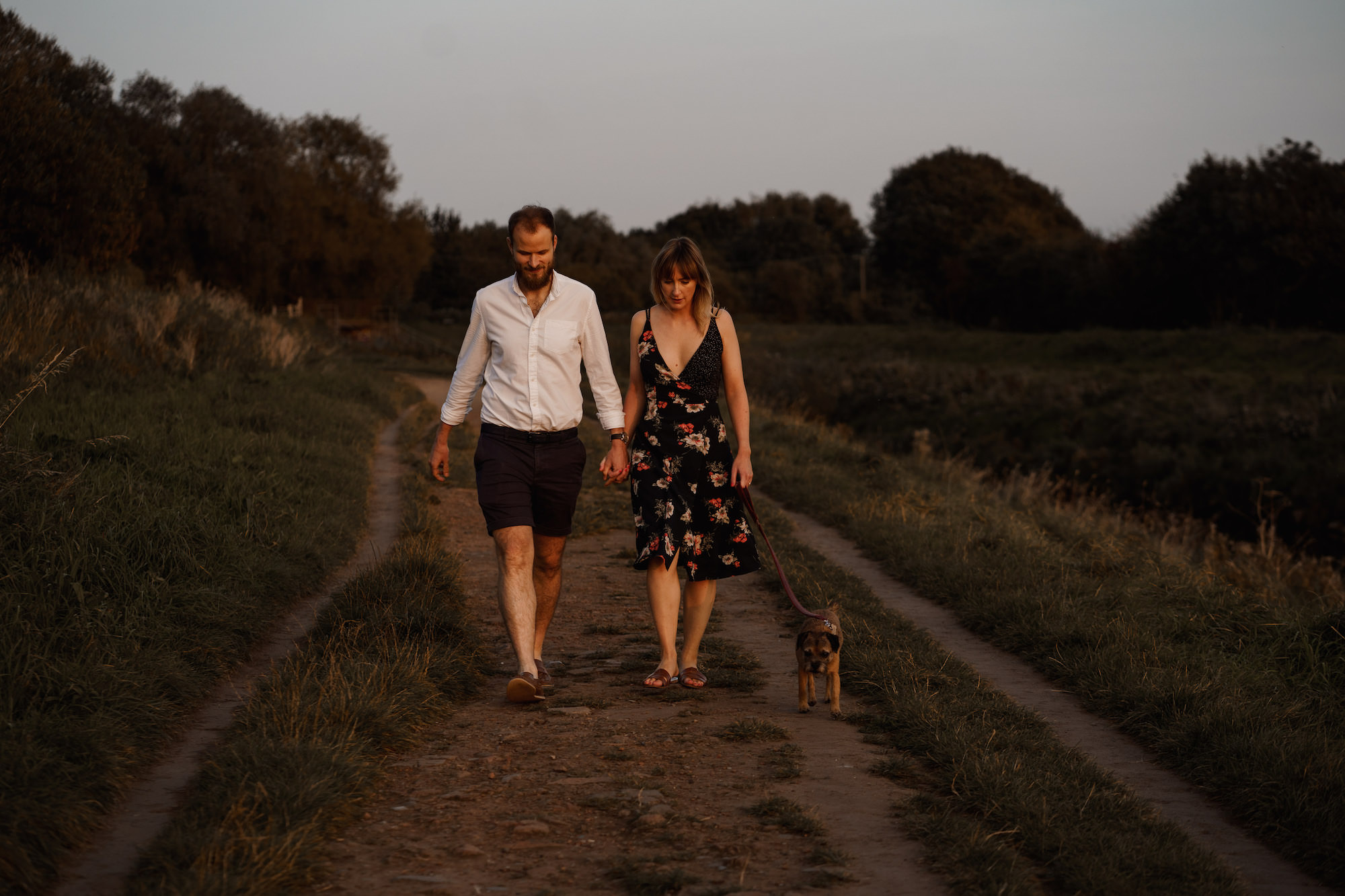 Couple walking their dog