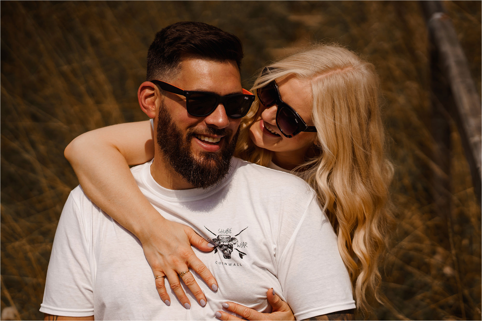 Bride hugging Groom from behind