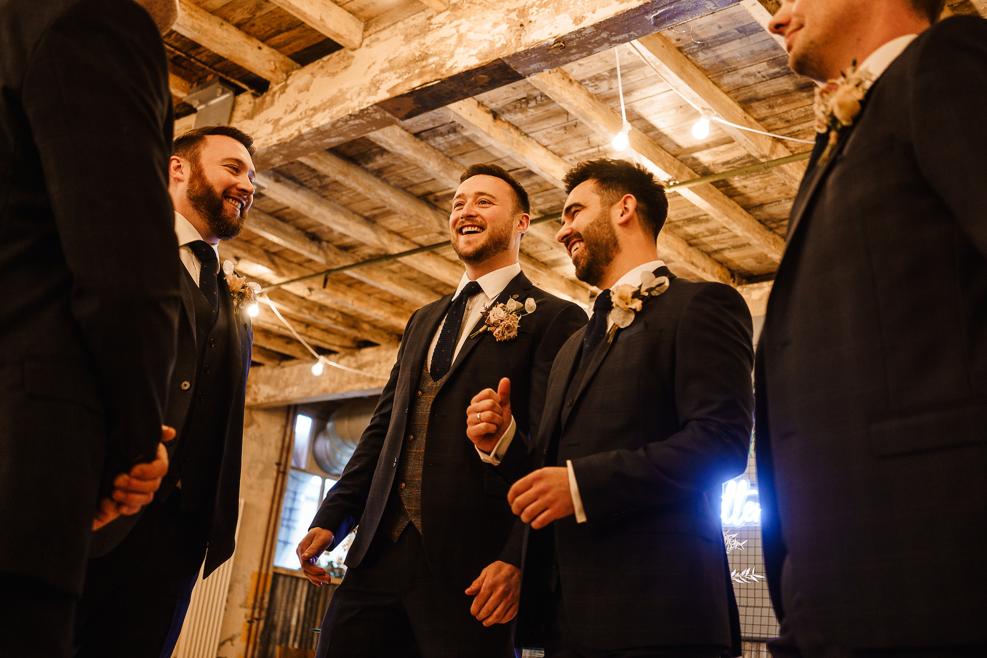 Groom and Groomsmen laughing before the wedding ceremony