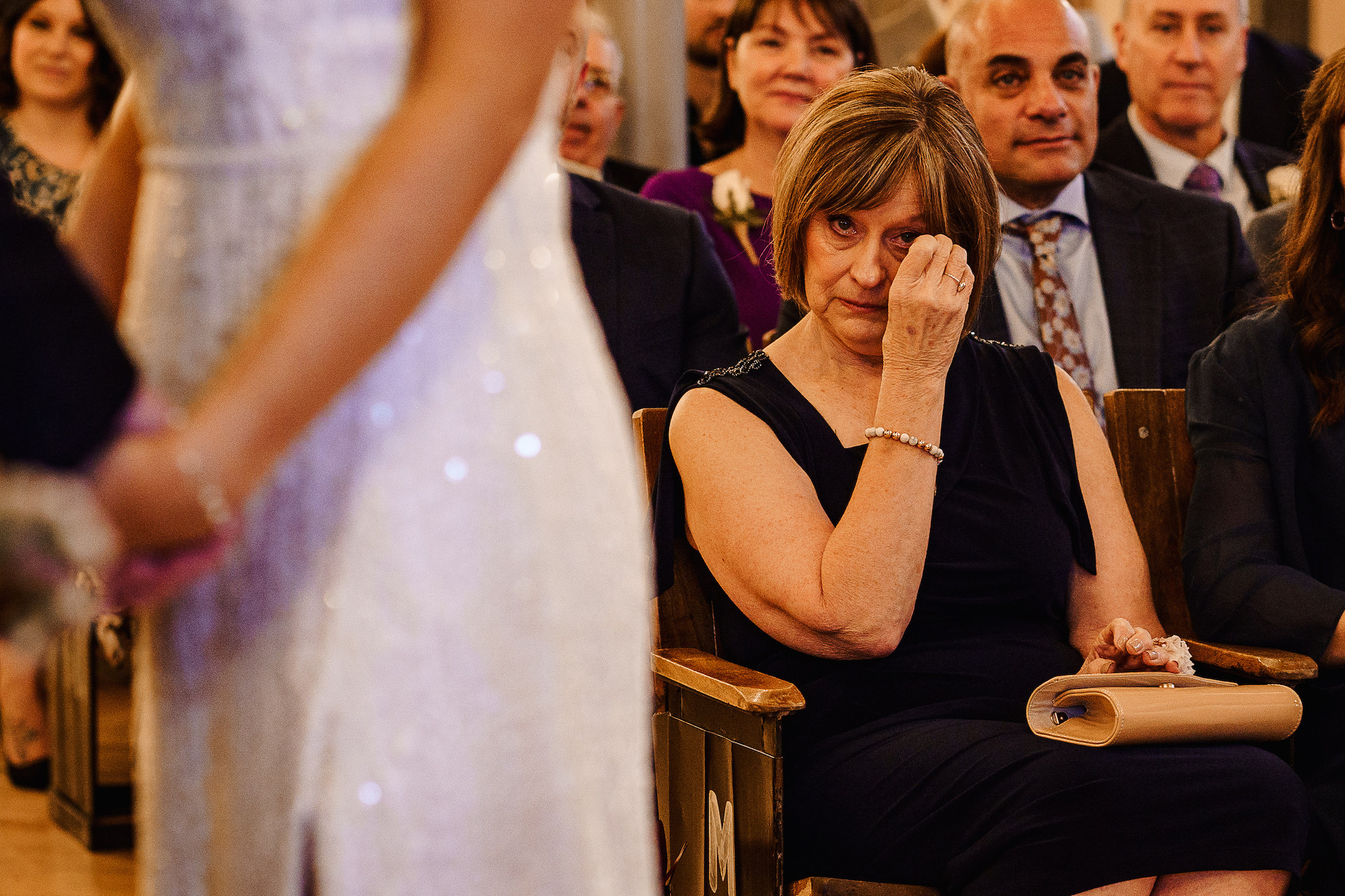 Mother of the Bride wiping a tear from her eye