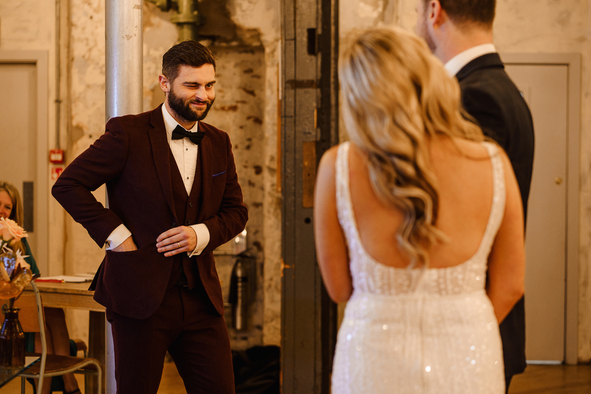 Best Man winking at the Bride and Groom after a reading
