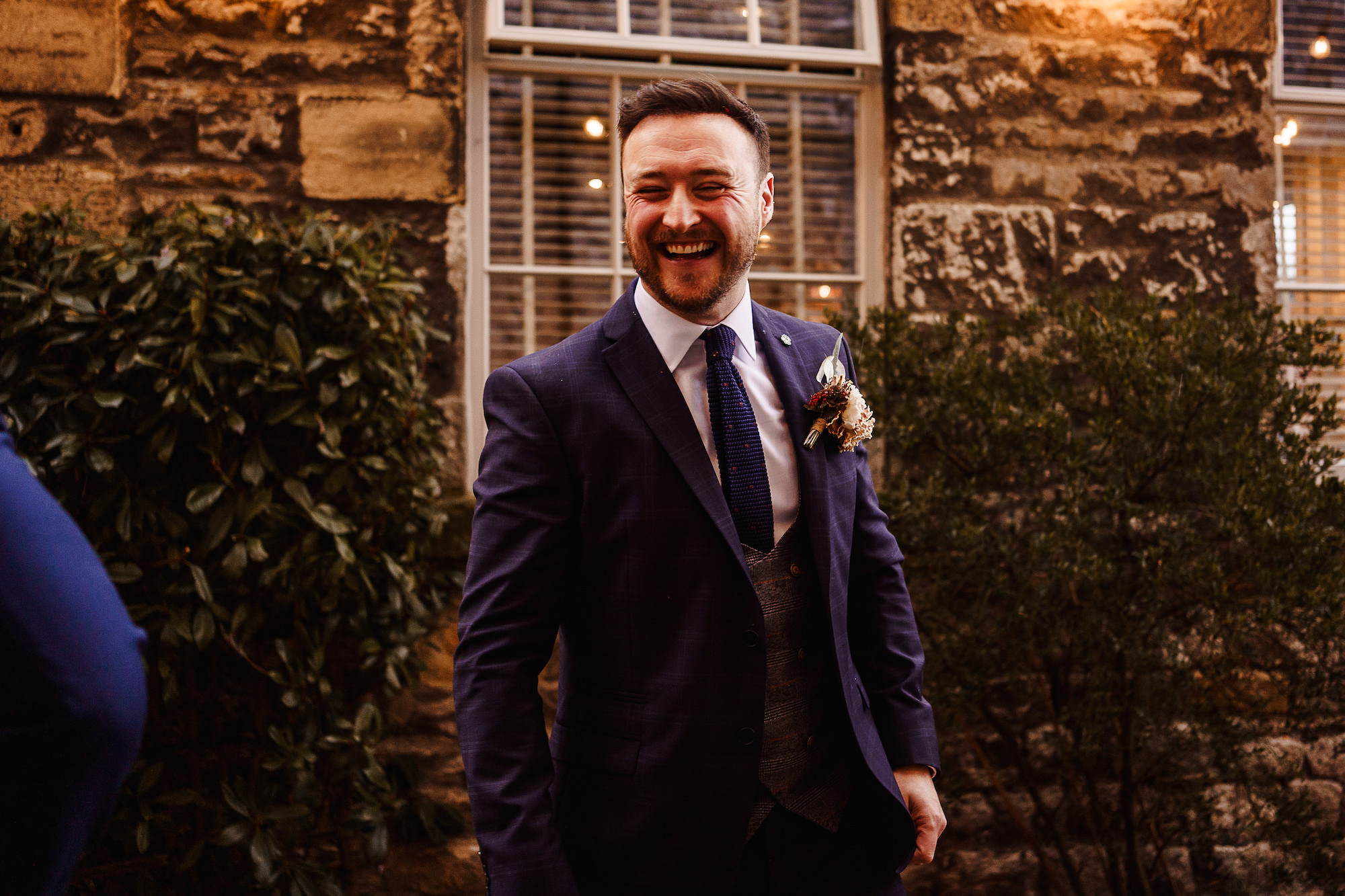 Groom laughing
