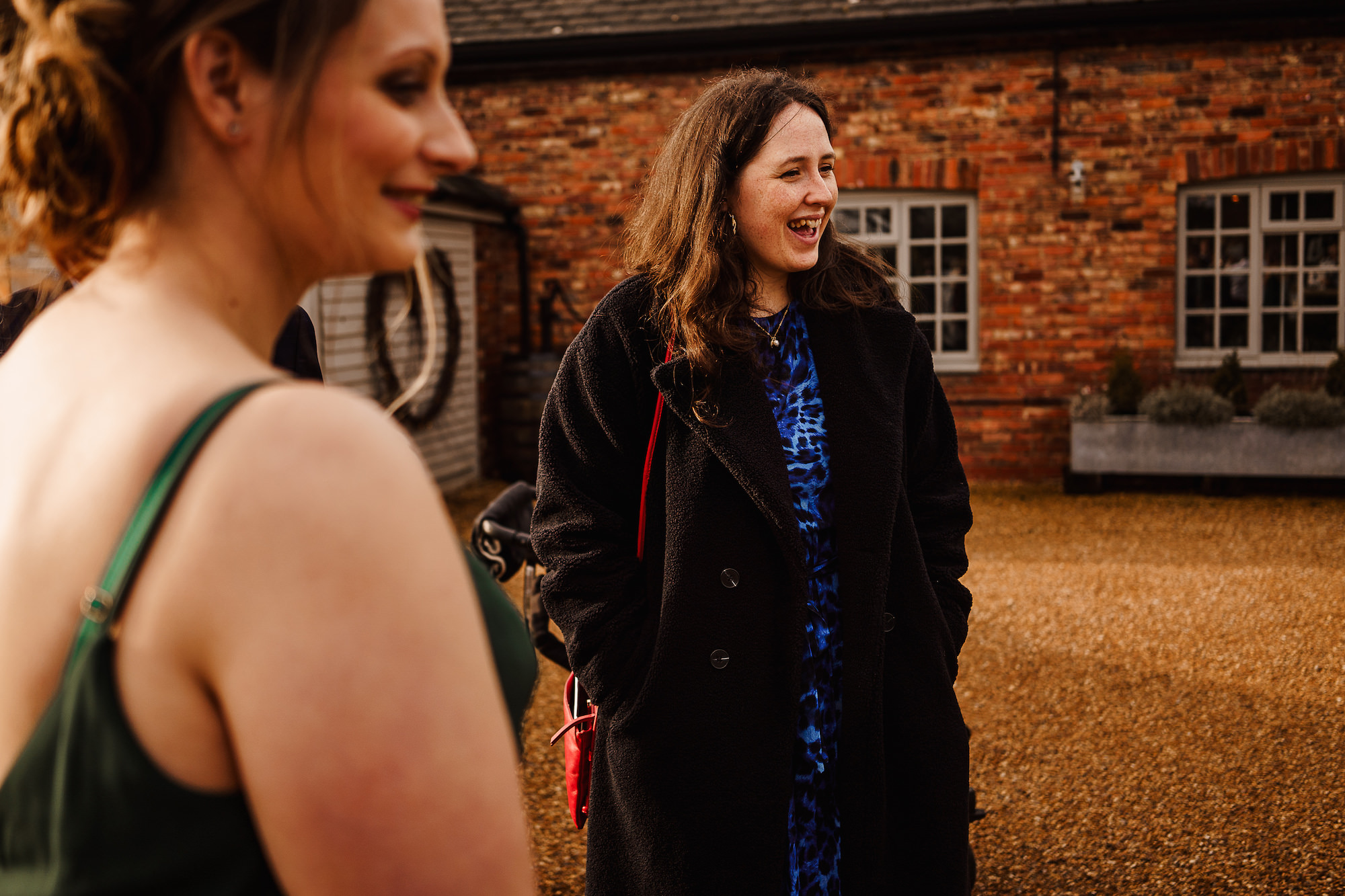 Wedding Guests laughing during drinks reception