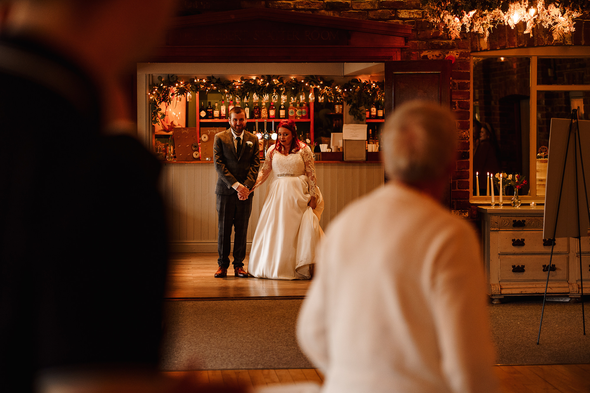 Bride and Groom walking into wedding breakfast