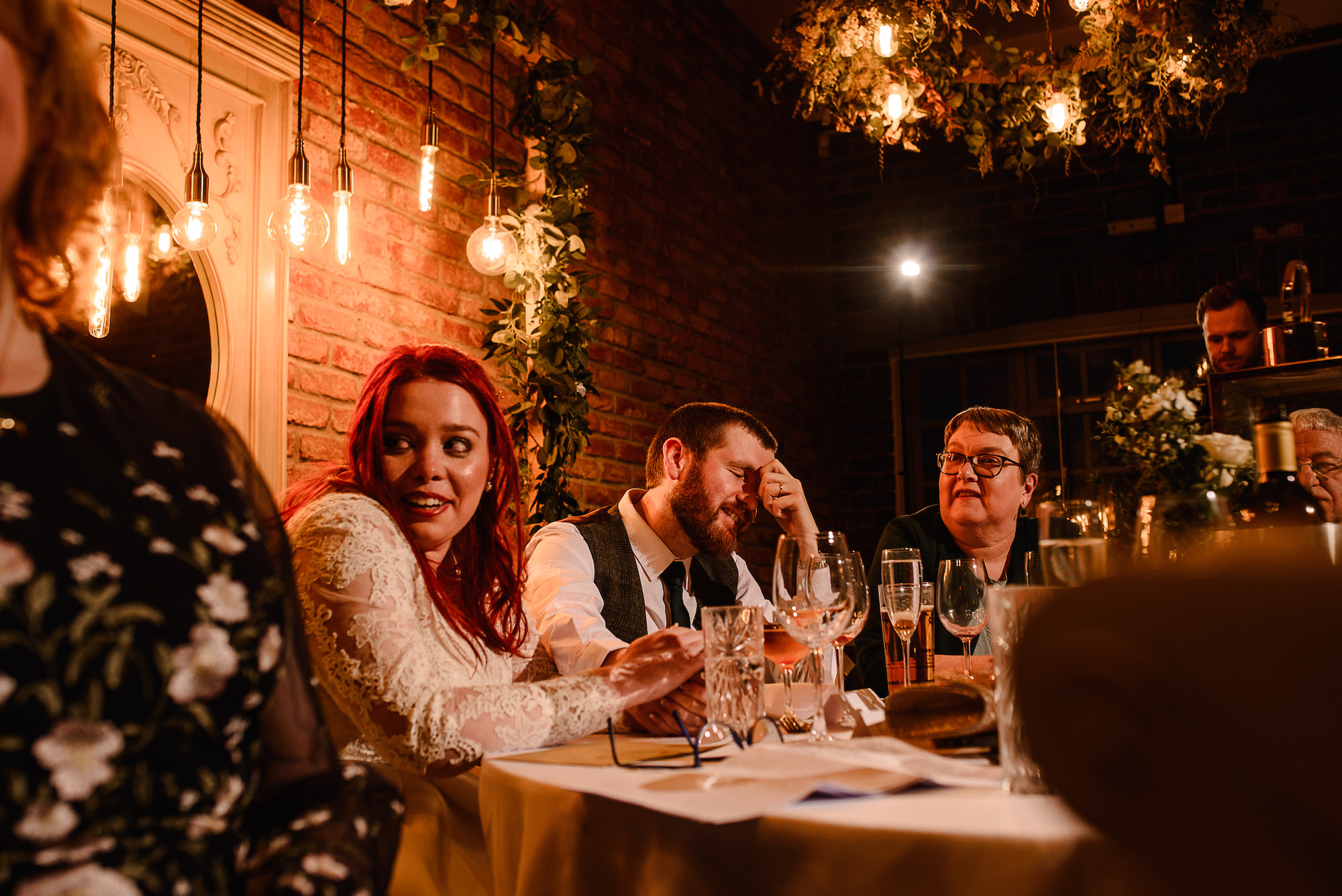 Groom covering face during speeches