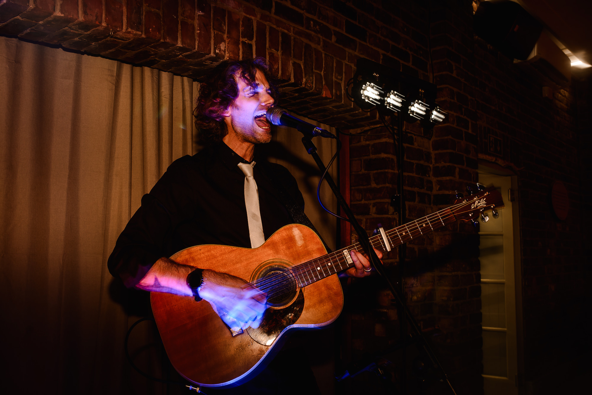 Singer with acoustic guitar